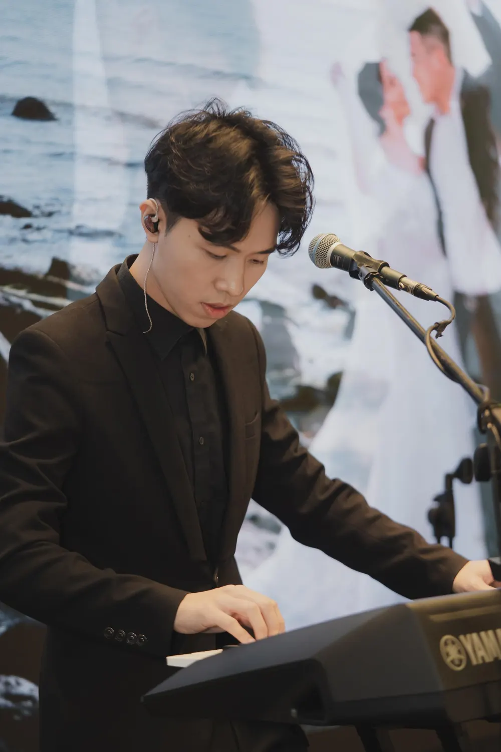 Keyboardist and vocalist performing live at a wedding